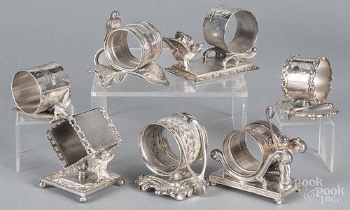 Seven silver-plate figural napkin rings, early 20th c., tallest - 3 1/2''.