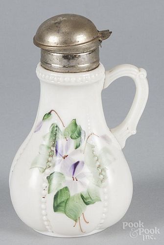Satin glass ribbon cruet, 20th c., 7'' h., together with a milk glass syrup with floral decoration