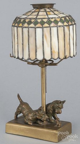 Bronze bedside lamp of Scottie dogs and a frog, early 20th c., with a paneled slag glass shade