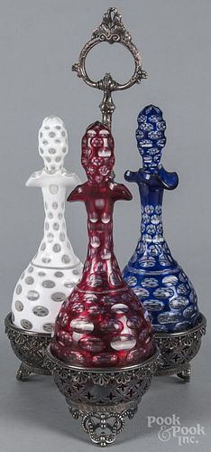 Set of three Bohemian cut to clear caster bottles, 19th c., in a silver-plated rack