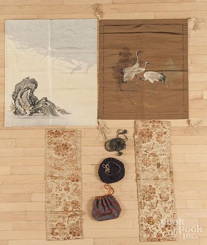 Japanese textiles, to include a pair of brocaded panels decorated with a bat motif