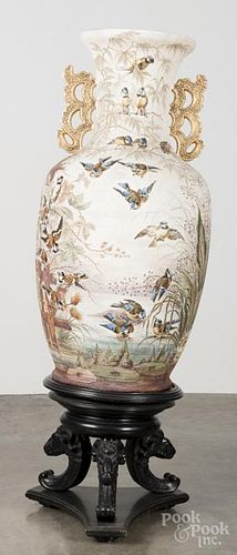 Porcelain palace urn, 20th c., with Japanesque decoration, with a stand, overall - 55'' h.