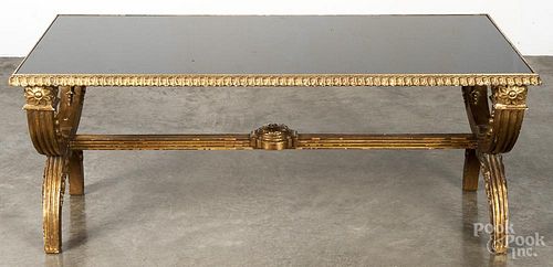 Italian giltwood low table, 20th c., with a glass top, 17 3/4'' h., 44 1/4'' w.