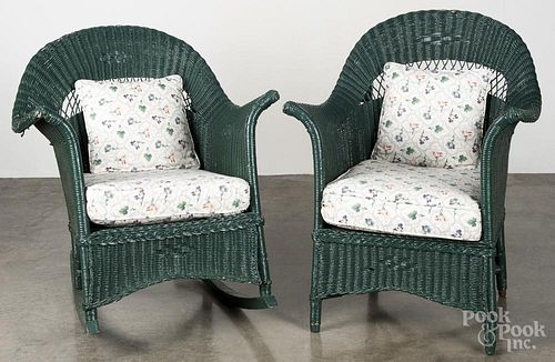Two green painted wicker chairs.