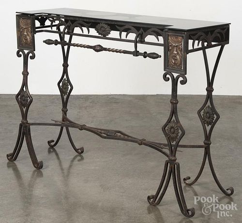 Wrought iron pier table with a black glass top, 31 1/4'' h., 40 3/4'' w.
