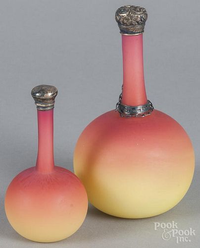 Two Burmese glass bottles, early 20th c., one with a sterling silver cap, 6'' h. and 4 1/2'' h.