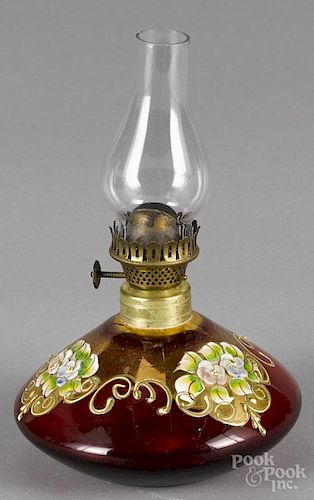 Miniature cranberry floral enameled oil lamp, ca. 1900, 4 1/4'' to top of burner.