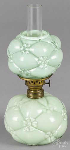 Miniature embossed green glass oil lamp, ca. 1900, with daisies, 7'' h. to top of shade