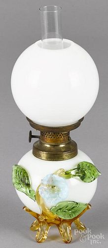 Miniature milk glass fluid lamp, ca. 1900, with applied floral decoration, 8 1/4'' h. to top of shade