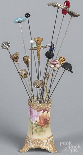 Hat pins, ca. 1900, with a Nippon porcelain hat pin holder.