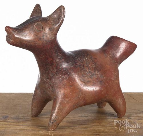 Colima pre-Columbian pottery dog vessel with a red glazed and a tail-formed spout, 8 3/4'' h.