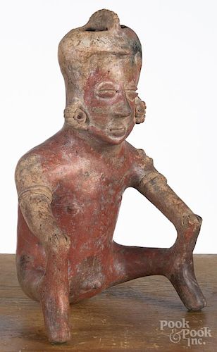 Colima pre-Columbian pottery vessel in the form of a seated man with his hands on his knees, 15'' h.