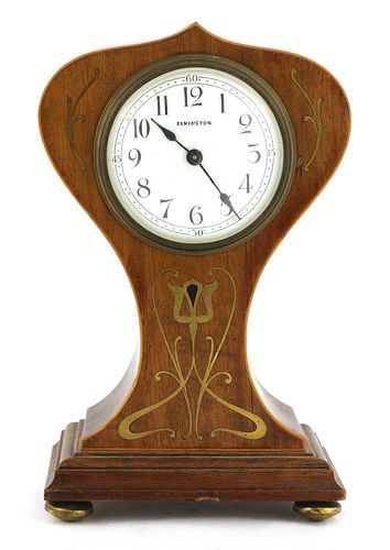 An Art Nouveau mahogany boxwood and brass-inlaid mantel clock,
