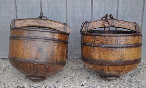 Two Asian Iron Bound Wooden Grain Carriers