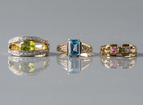 Three Gold Rings With Gemstones