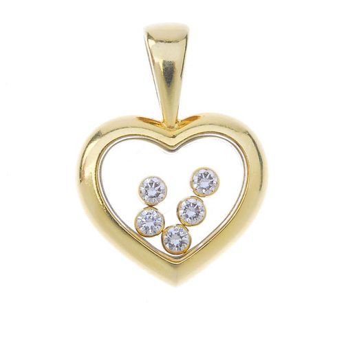 A diamond heart pendant. The free-moving brilliant-cut diamond collets, within a glazed heart, to th