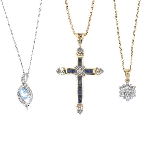 A selection of three diamond and gem-set pendants. To include a 9ct gold sapphire and diamond cross,
