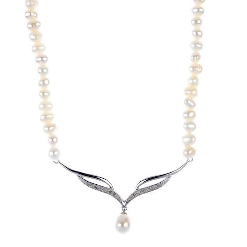 A diamond and cultured pearl necklace. Designed as a pave-set diamond crescent, opposing a plain cou