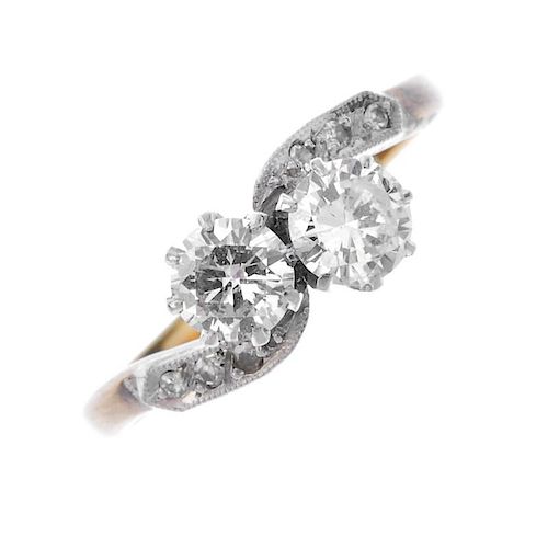 A mid 20th century 18ct gold and platinum diamond two-stone ring. The twin brilliant-cut diamonds, t