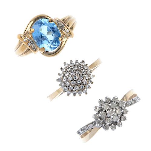 A selection of three 9ct gold gem-set ring. To include a blue topaz ring with diamond accents sides,