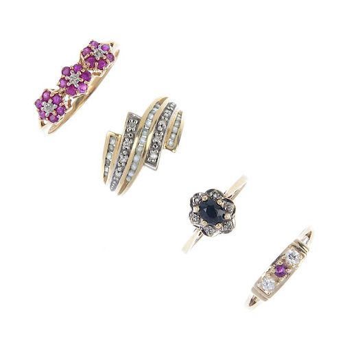 A selection of four gem-set rings. To include a sapphire and diamond floral cluster ring, a ruby and