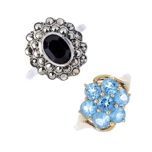 A selection of four 9ct gold gem-set dress rings. To include a 9ct gold blue topaz cluster ring, a s