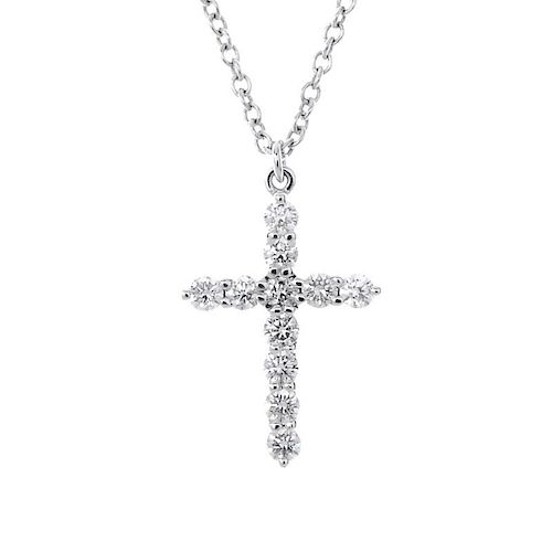 TIFFANY & CO. - a diamond cross pendant. The brilliant-cut diamond cross, suspended from a trace-lin