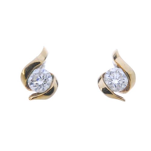 A selection of diamond jewellery. To include a diamond cross, a pair of 9ct gold diamond ear studs,