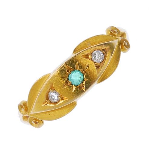 A late Victorian 18ct gold emerald and diamond three-stone ring. The circular-shape emerald and sing