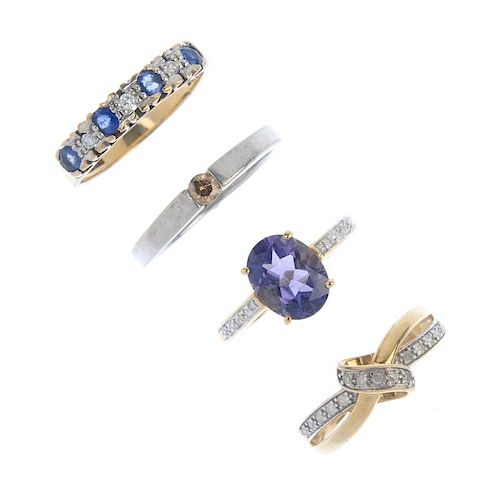 A selection of four 9ct gold diamond and gem-set rings. To include a diamond stylised knot ring, a s