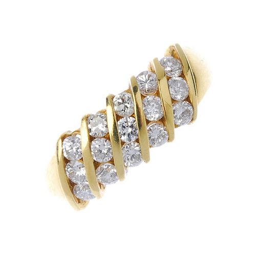 An 18ct gold diamond dress ring. Designed as a series of brilliant-cut diamond diagonal lines, with