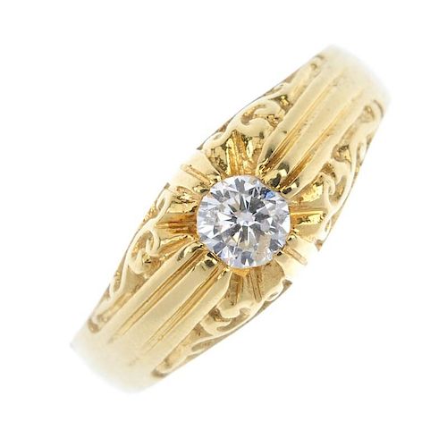 An 18ct gold diamond single-stone ring. The brilliant-cut diamond, to the scrolling sides and tapere