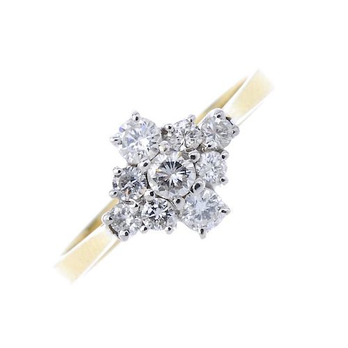 An 18ct gold diamond cluster ring. Of marquise-shape outline, the brilliant-cut diamond line, with s