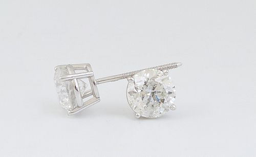 Pair of 18K White Gold Diamond Stud Earrings, each with a 1.03 ct. prong set round diamond, total diamond wt.- 2.06 cts., with appraisal.