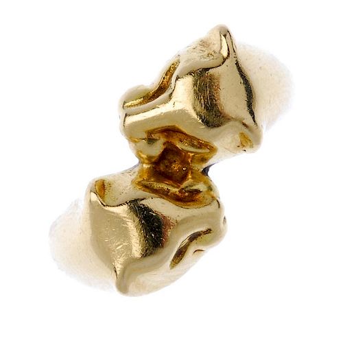 A double panther ring. Designed as two panther heads, to the tapered band. Weight 7.2gms. <br><br>Ov