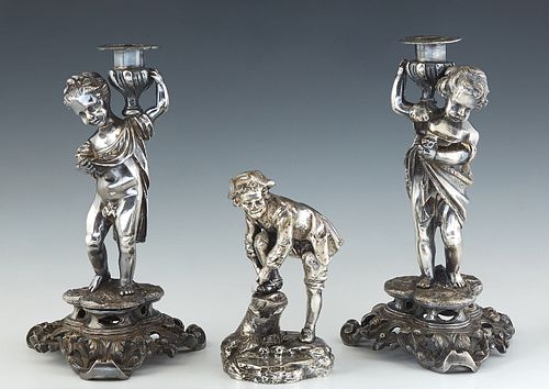 Pair of Silverplated Figural Candlesticks, late 19th c., with a male and female putto upholding a candle cup on one shoulder, on a tripartite plinth a
