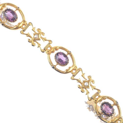 An early 20th century gold garnet-topped-doublet and split pearl bracelet. Of scrolling design, the