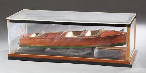Vintage Carved Mahogany Chris Craft Speedboat Model, presented in a lucite case, Case- H.- 10 1/4 in., W.- 30 1/2 in., D.- 12 1/8 in., Boat- H.- 3 1/2