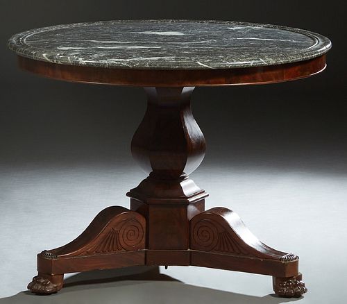 French Empire Carved Mahogany Marble Top Center Table, 19th c., the highly figured dished circular grey marble over a small skirt, on a tapered hexago