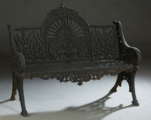 Ornate Reticulated Cast Iron Bench, 20th/21st c., the center fan back with a shell and scroll crest over a pierced trefoil emanating rays, flanked by 