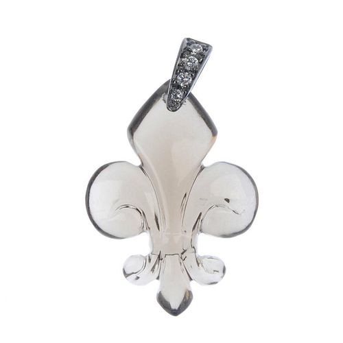 A smokey quartz and diamond pendant. The carved smokey quartz fleur-de-lys, to the brilliant-cut dia