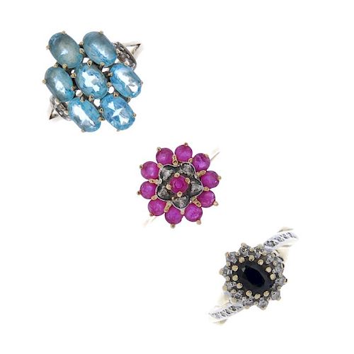 A selection of three gem-set rings. To include a 9ct gold sapphire and diamond cluster ring with asy