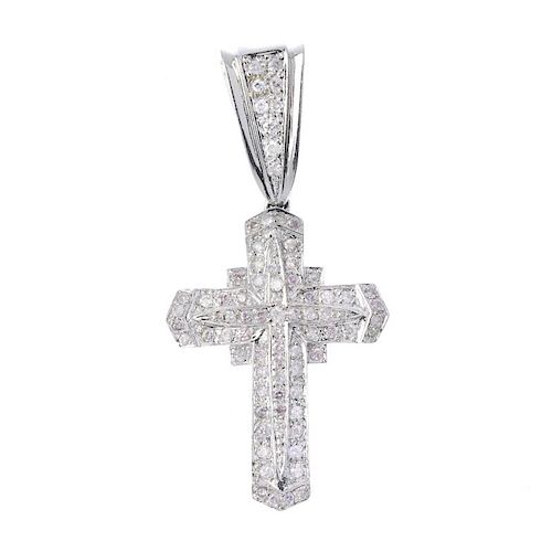A 14ct gold diamond cross. Set throughout with brilliant-cut diamonds, to the brilliant-cut diamond