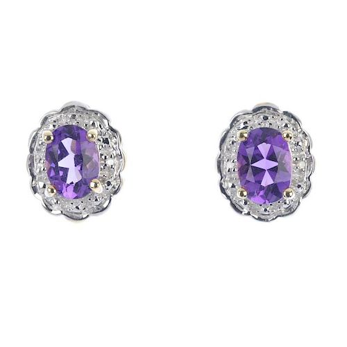A pair of 9ct gold amethyst and diamond cluster ear studs. Each designed as an oval-shape amethyst,