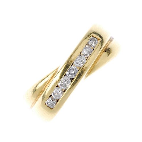 A diamond crossover ring. The brilliant-cut diamond diagonal line, to the crossover and tapered band