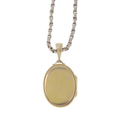 An Edwardian 9ct gold locket, with chain. The oval-shape locket, with beaded border, suspended from