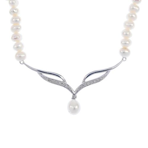 A 9ct gold diamond and freshwater pearl necklace. The single-cut diamond openwork panel, suspending