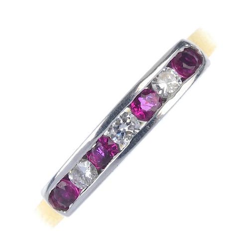 An 18ct gold ruby and diamond seven-stone ring. The alternating circular-shape ruby and brilliant-cu