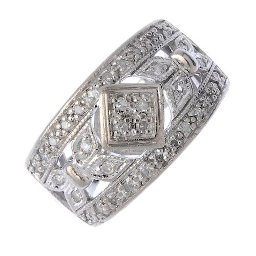 An 18ct gold diamond dress ring. Of openwork design, the single-cut diamond quatrefoil, with similar