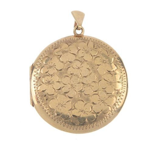 A 1970s 9ct gold locket. Of circular outline, the foliate front, with plain back and tapered surmoun